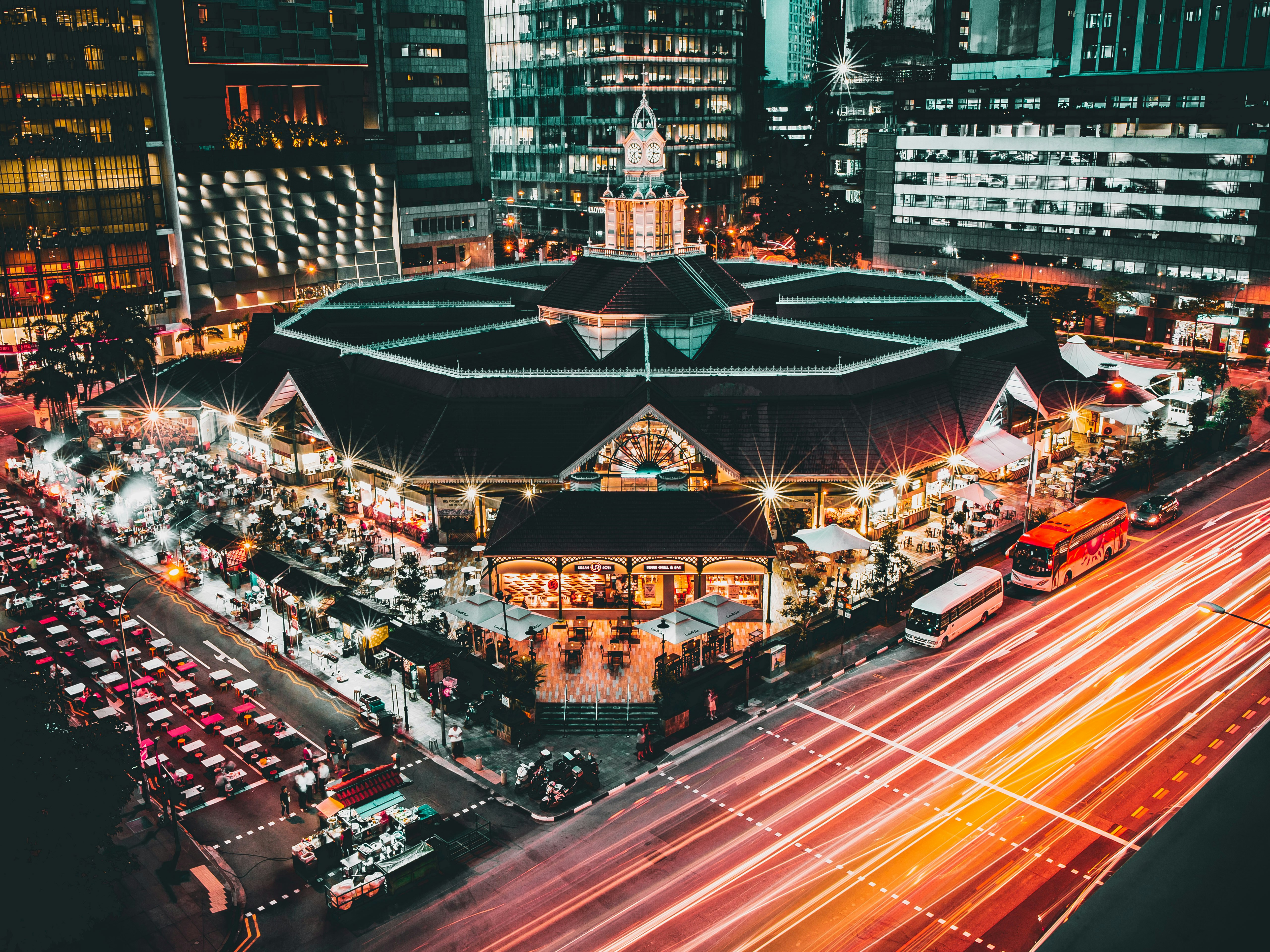 aerial photography of buildings and cars on road during nighttime